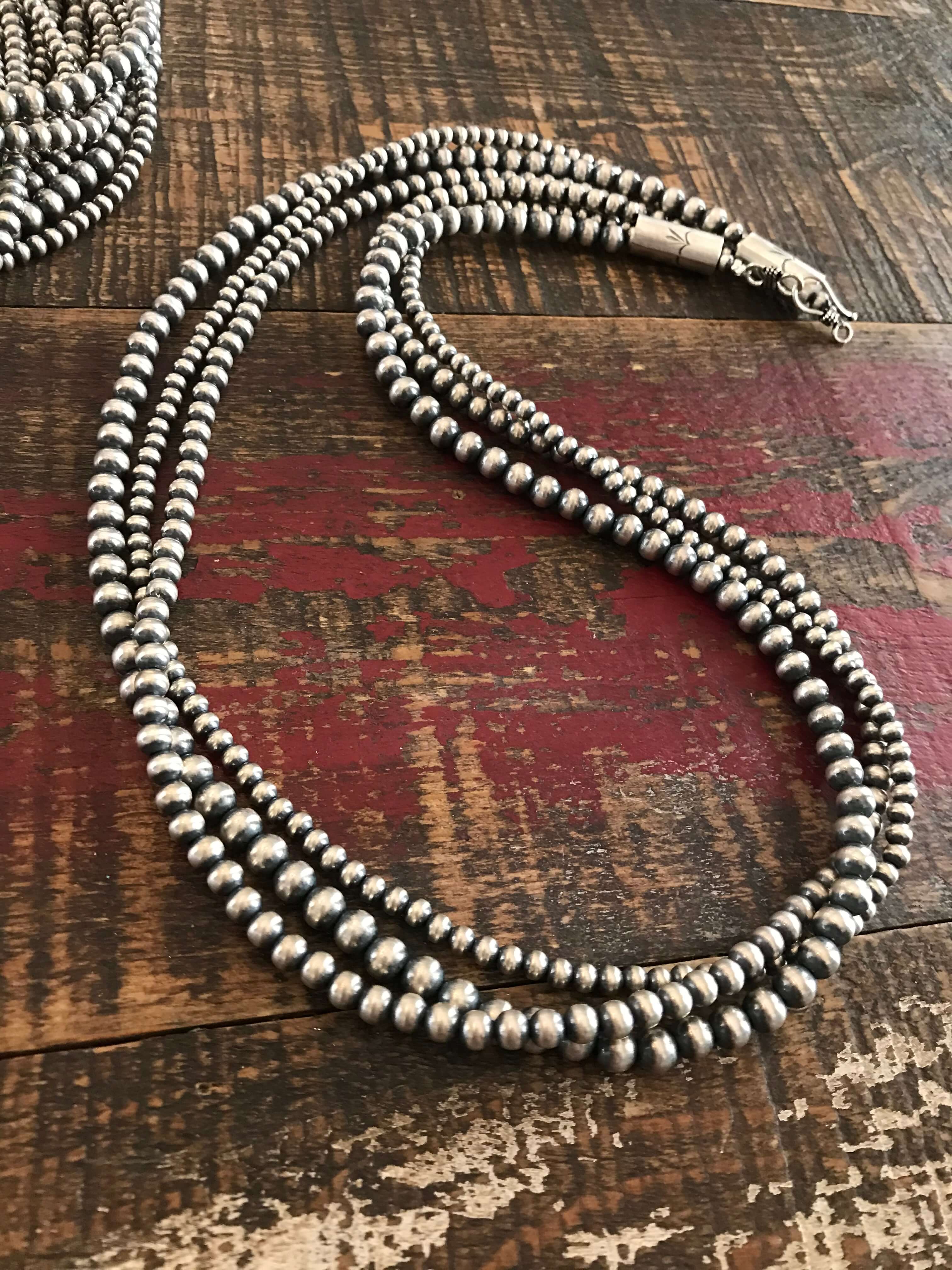 The Triple Strand Pearl Necklaces - Image 4