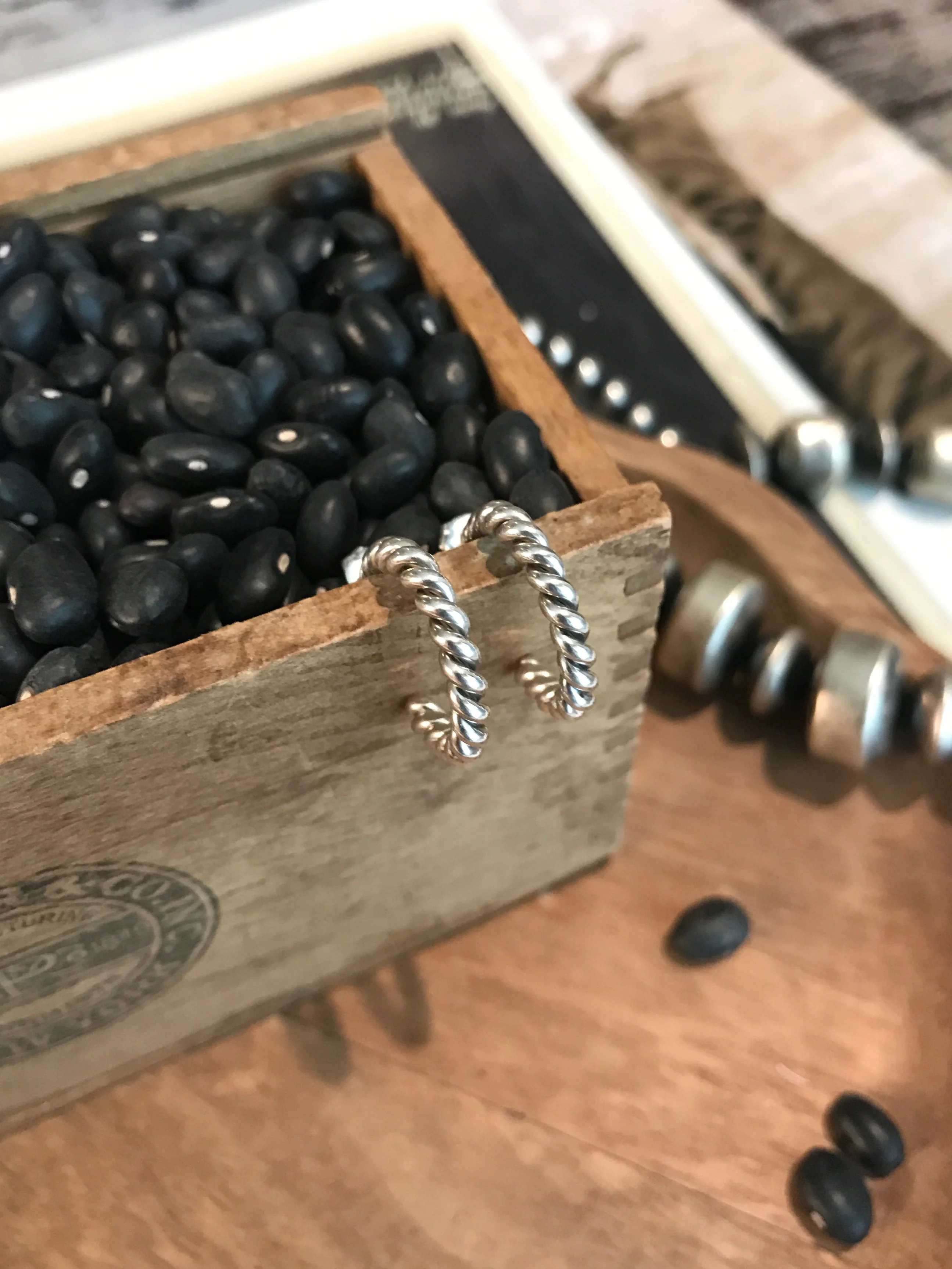 The Twist Huggie Hoops